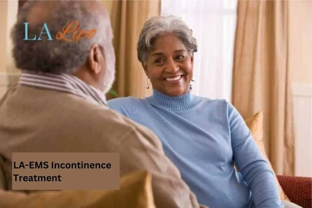 Couple sat smiling at each other - LA-EMS treatment Ealing