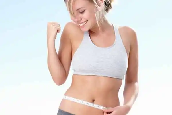 woman happy after fat reduction treatment Ealing