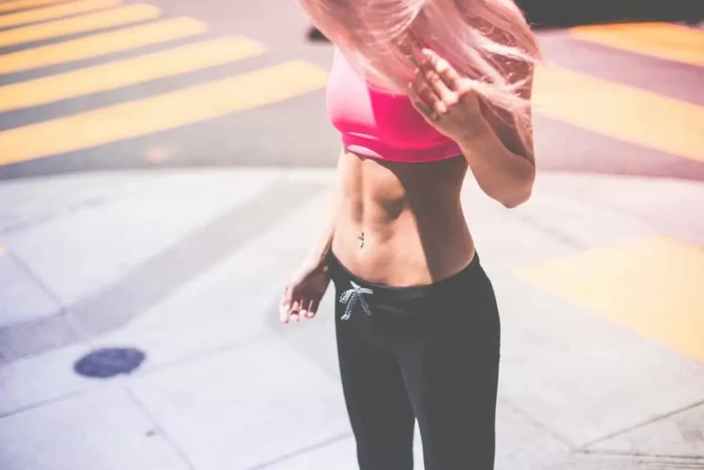 Woman with toned stomach after LA-EMS Body Sculpting Treatment Ealing 