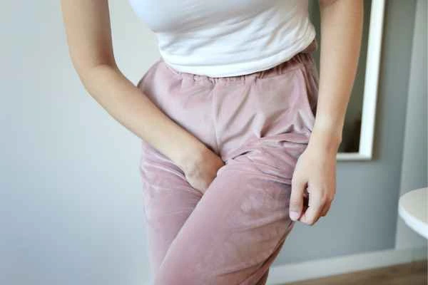 woman running for the toilet because of urinary incontinence Ealing